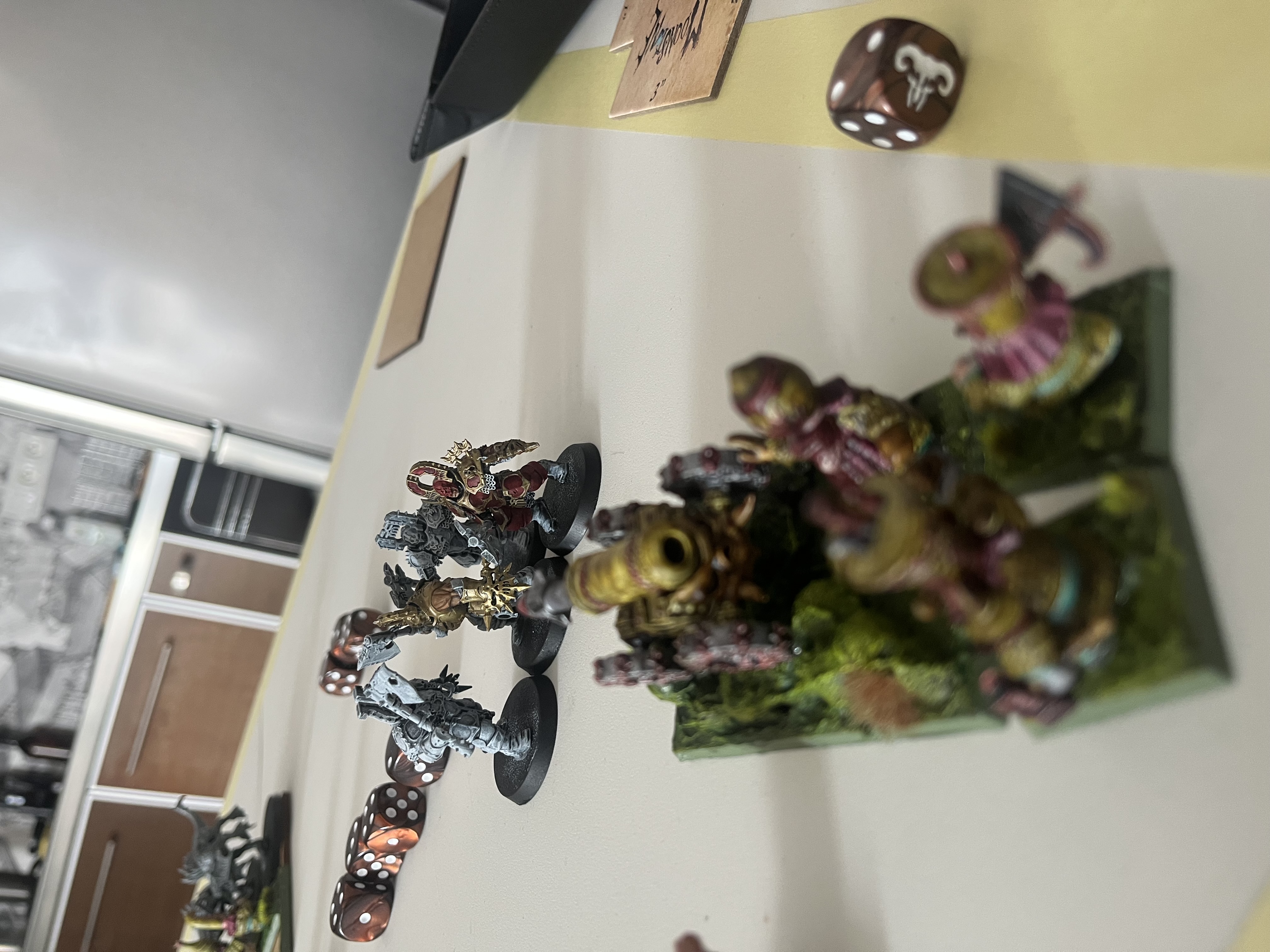 Chaos Dwarfs and Daemons facing off