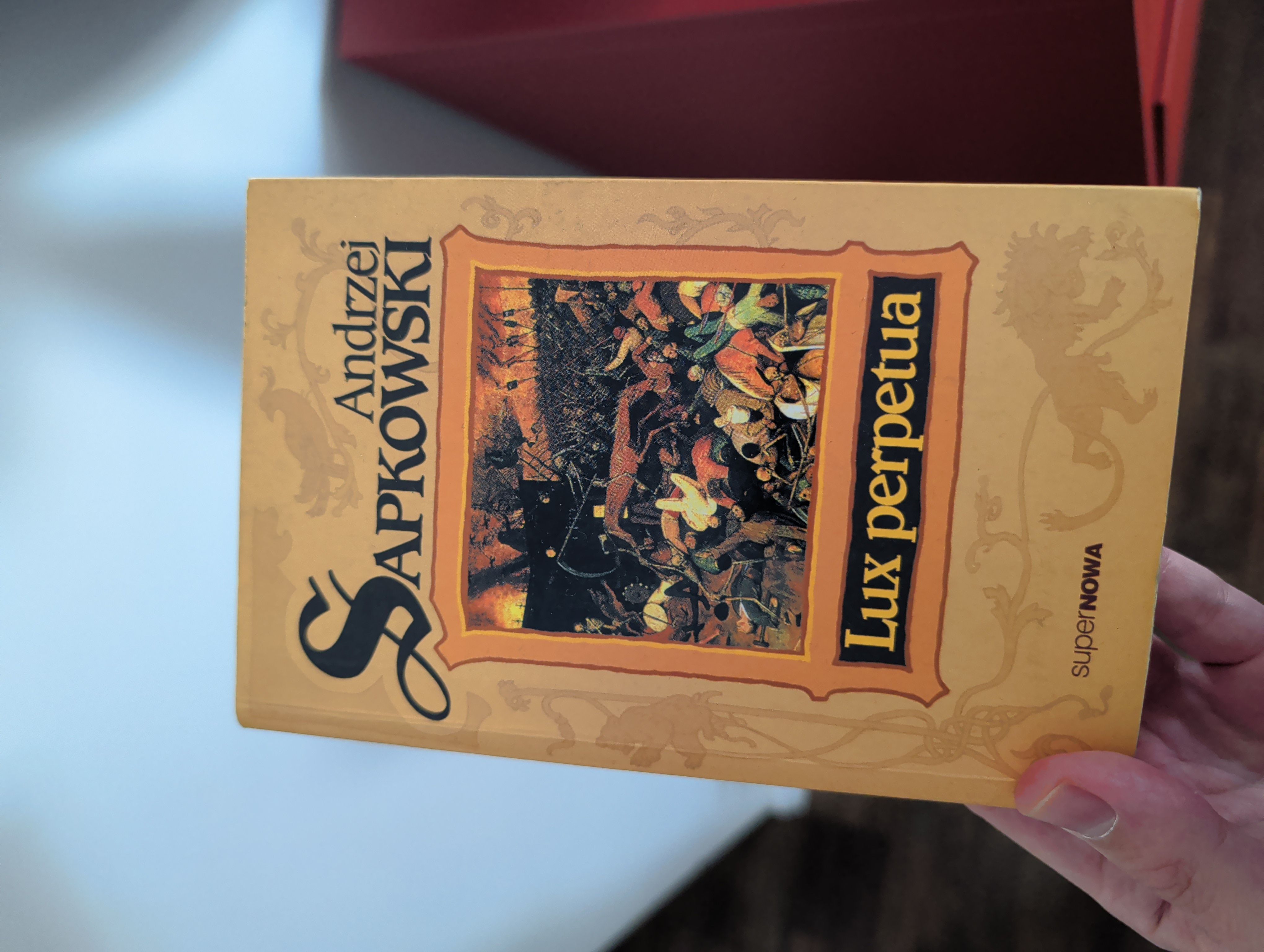 A stack of Sapkowski books offered to the group