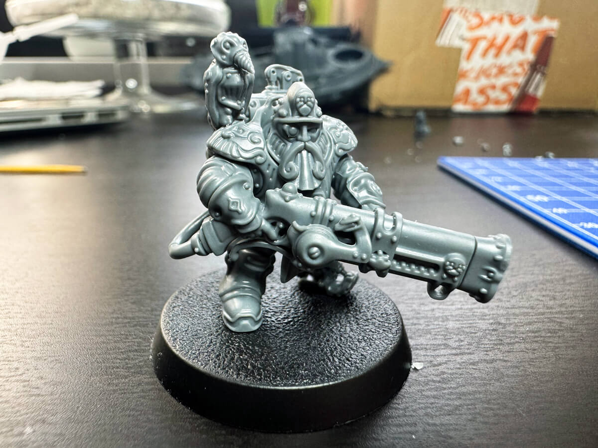 Owl miniature with a metal leg